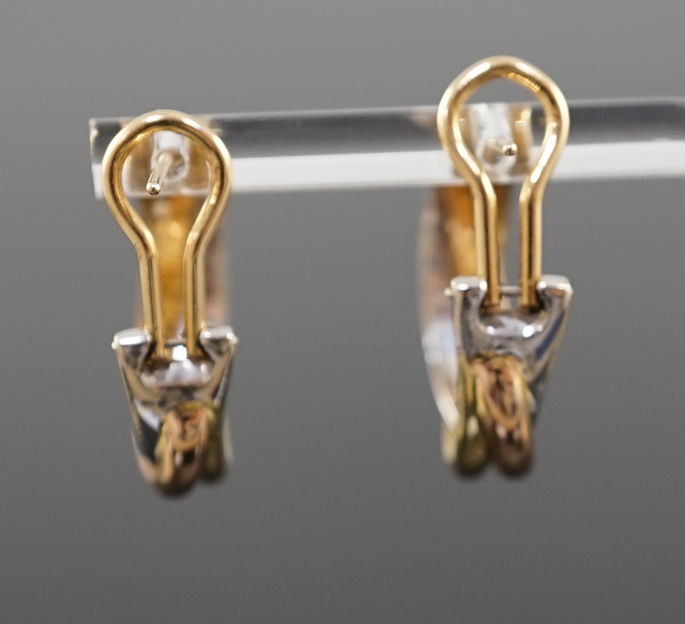 A modern pair of Cartier three colour 18ct gold Trinity earrings